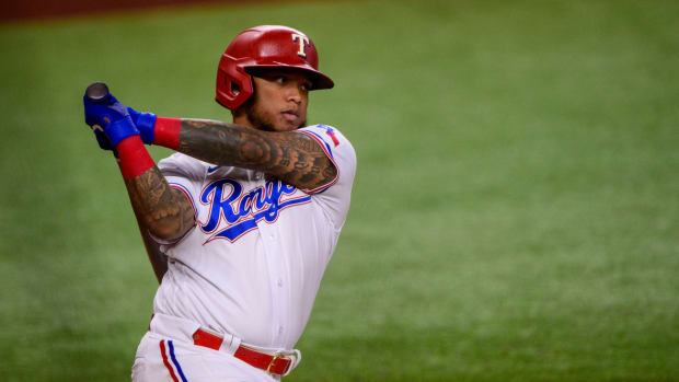Apr 28, 2022; Arlington, Texas, USA; Texas Rangers designated hitter Willie Calhoun (4) bats against the Houston Astros during the third inning at Globe Life Field.